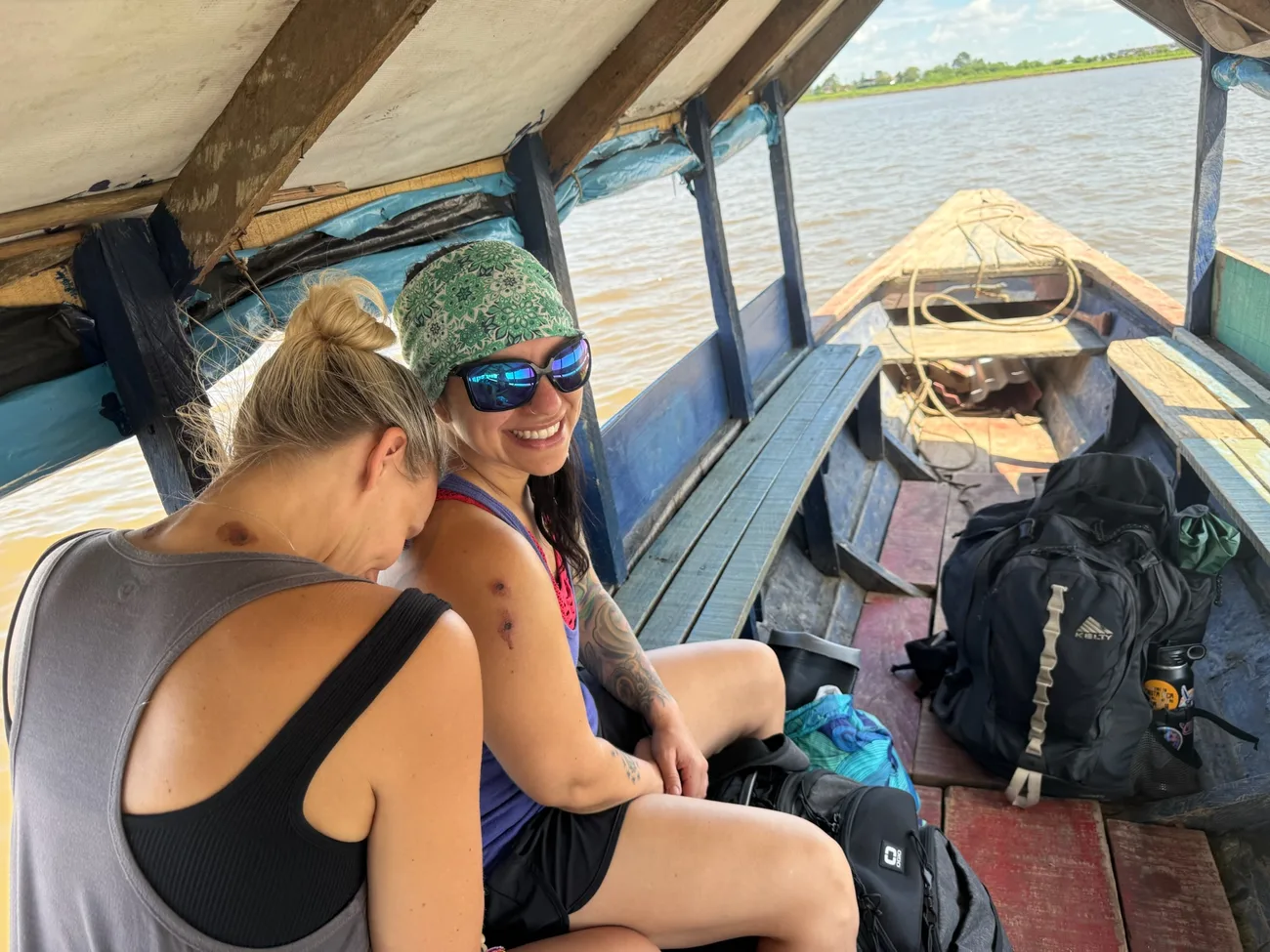 Susan and McKenzie traveling the Amazon river by boat