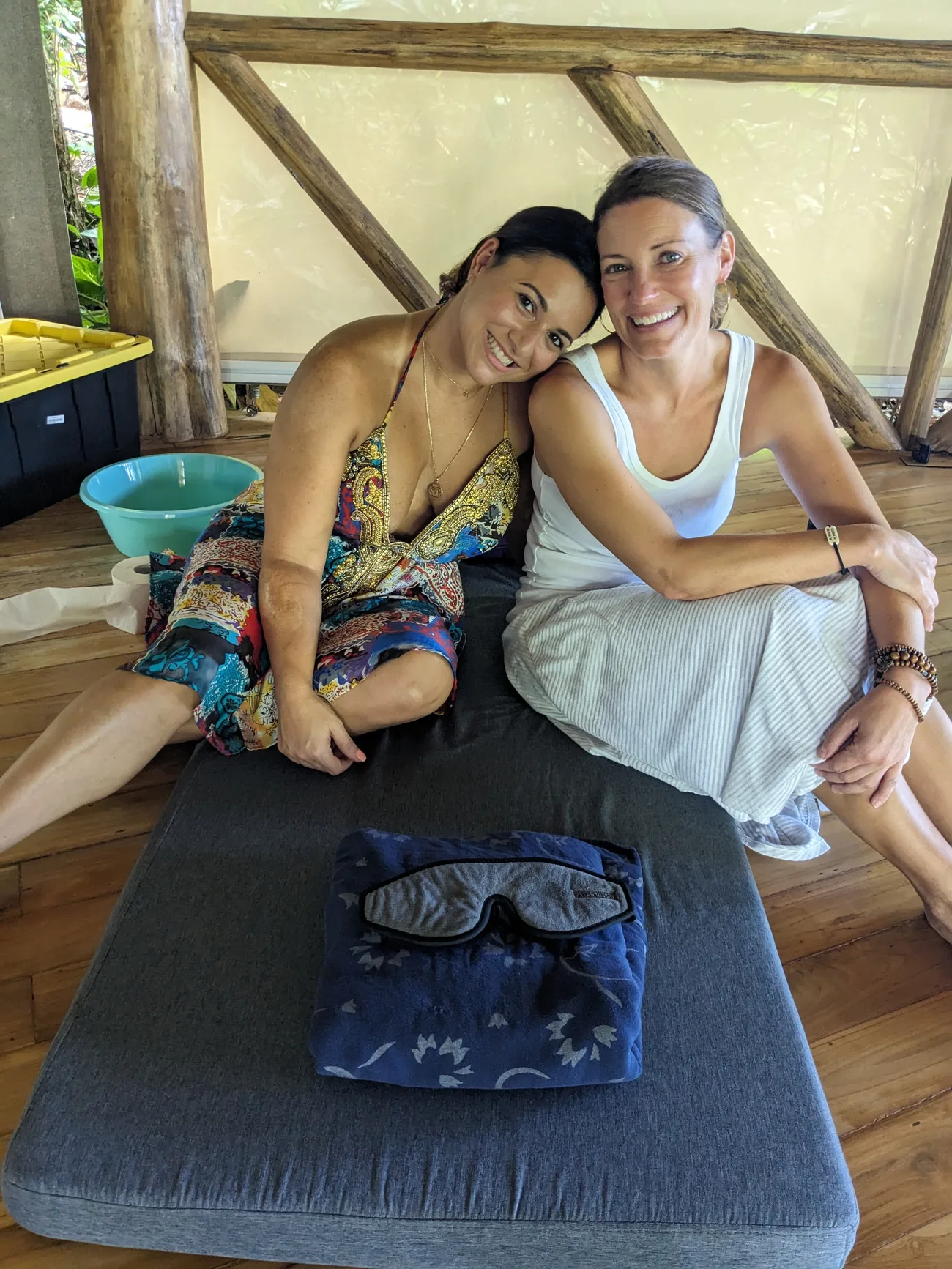 Two women resting together in the shala