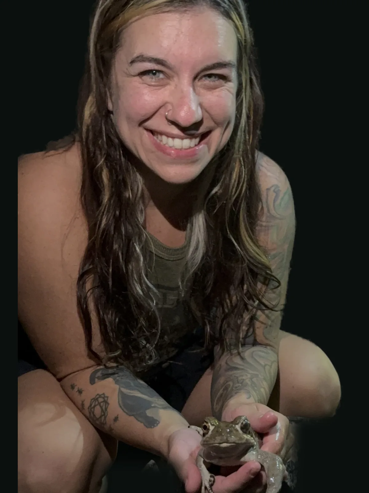 McKenzie smiling with the Bufo toad at night