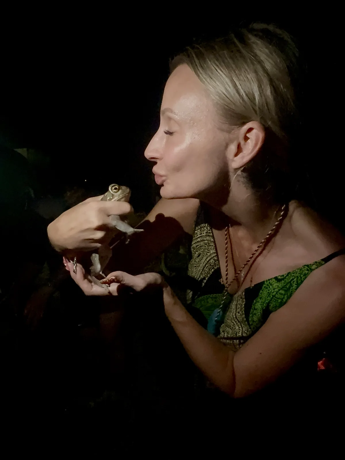 Susan holding the Bufo toad at night in the Sonoran Desert