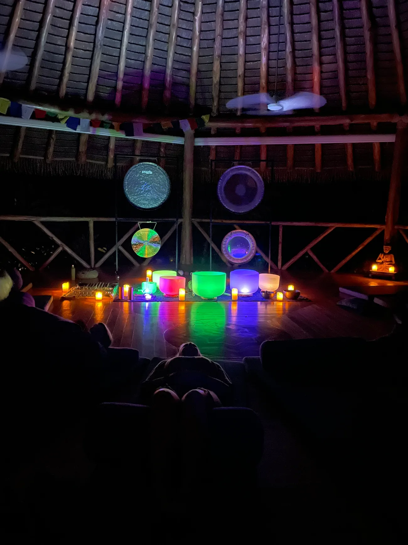 Crystal bowls and gongs glowing at night in the shala